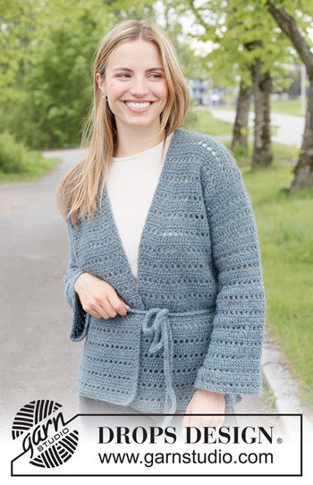 damesvest met elegant kantpatroon en ceintuursluiting