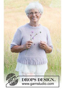 Damestrui met korte mouwen en gebreide kwastjesrand langs de boord