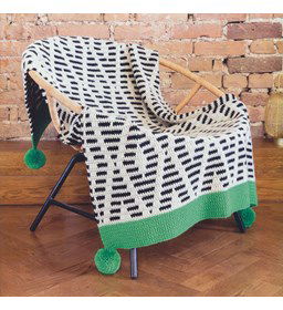 Ruitendeken met pompons gemaakt van Scheepjes Colour Crafter