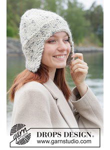 Warme gebreide muts met oorflappen in ribbelsteek