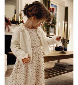 Meisjesvest met gerimpelde halsbies gemaakt van Phildar Phil Irise