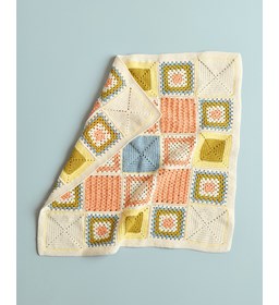 vierkante in blokken gehaakte babydeken gemaakt van Haaknaalden