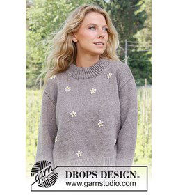 Damestrui met boterbloempjes en dubbel gebreide brede halsboord. gemaakt van Drops Merino extra fine