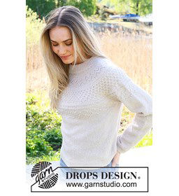 Damestrui met ronde pas in ajourpatroon gemaakt van DROPS Flora