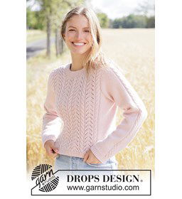 Romantische gebreide trui met kabels en kantpatroon gemaakt van Breinaalden zonder knop