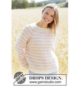 Oversized gebreide raglantrui met spikkelstrepen gemaakt van DROPS Fiesta