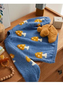 Babytrui met paddestoelen.