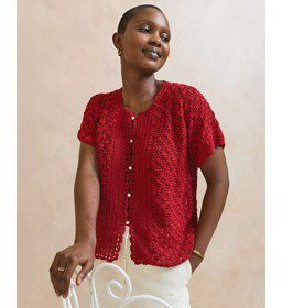 Damesvest met geschulpte rand gemaakt van knopen