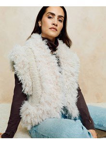 mouwloze jas met afwerking in bontlook