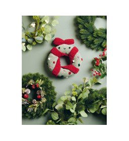 Kerstkrans met glimlach gemaakt van Haaknaalden