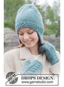 Warme gebreide muts met oorflappen van DROPS Snow