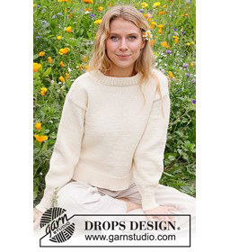 Damestrui met ronde hals en splitten in de zijnaad. gemaakt van Drops Big Merino