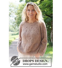 Damestrui met ronde pas in ajourpatroon. gemaakt van Drops Air