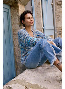 Korte damestrui gebreid in ajourpatroon