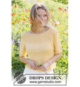 Damestruitje met korte mouwen en ronde pas in kabelpatroon. gemaakt van Drops Muskat