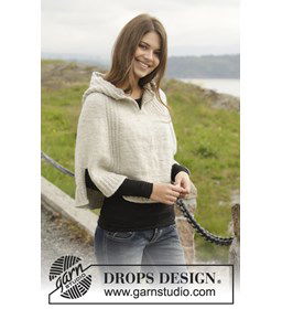 Gebreide poncho met capuchon en split gemaakt van knopen