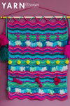 Haakpatroon Wandkleed met zigzagpatroon en pompoms