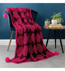 Zonnevlekkendeken met pompons gemaakt van Scheepjes Colour Crafter