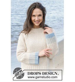 Damestrui met extra brede manchetten en taille boord. gemaakt van Drops Kid Silk