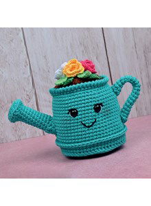 Gieter gevuld met bloemen