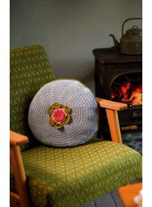 Rond kussen met bloem