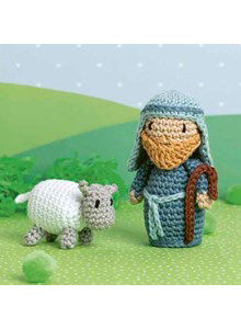 Herder met schaap van de kerststal