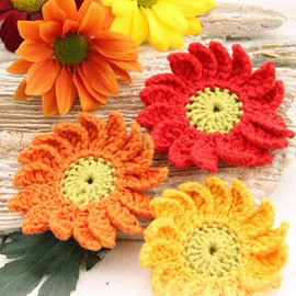 Drops Gehaakte bloemen: margrieten in warme kleuren van Safran.