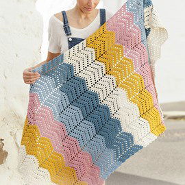 Drops DROPS haakpatroon deken Taste of Rainbow met zigzag patroon. Deze deken is gehaakt van het garen DROPS Paris.  Deze deken is circa 80 x 125 cm.