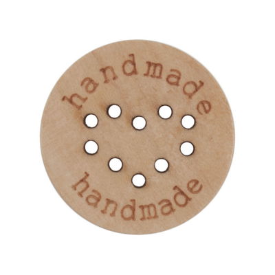 Knoop 23 mm hout handmade en hart in gaatjes